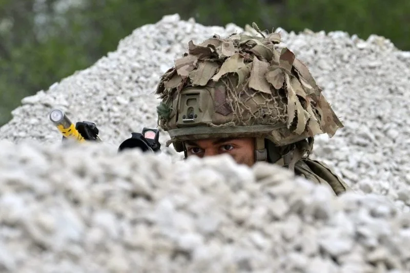 A British soldier takes part in a NATO exercise near the Estonian-Latvian border in Voru, Estonia, on May 25, 2022.