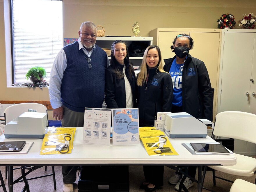 The Rev. Tony Carter Jr., left, poses for a photo at a health event at his church. He said he tries to host a community health event for his parishioners at Salem Missionary Baptist Church in Kansas City, Kansas, once a month.