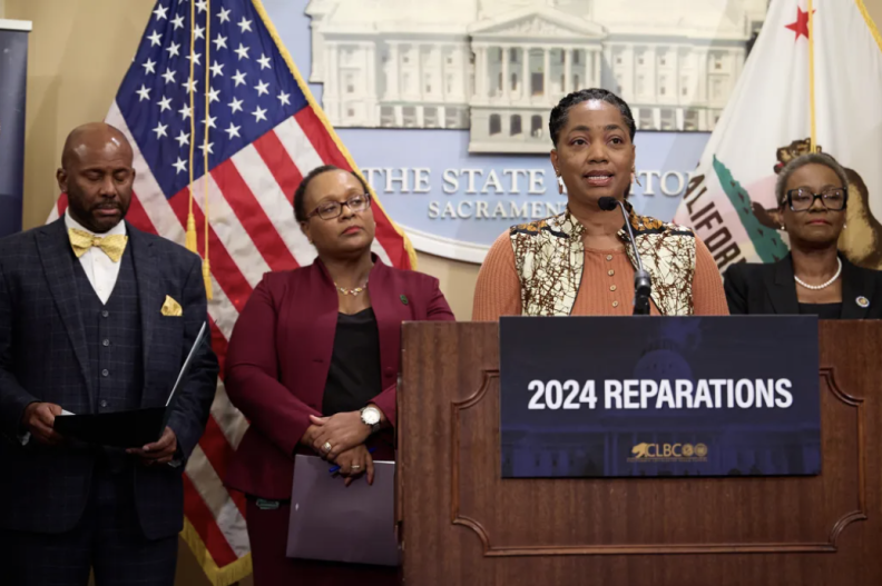 Assemblymember Akilah Weber speaks during a press conference led by the California Legislative Black Caucus at the state Capitol in Sacramento on Feb. 21, 2024. Assemblymember Reggie Jones-Sawyer introduced AB 3089, a bill that seeks a formal apology for the state’s role in chattel slavery. 