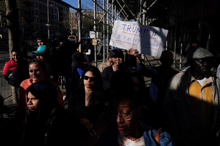 Crowds wait for Trump to arrive at the Sanaa convenient store 