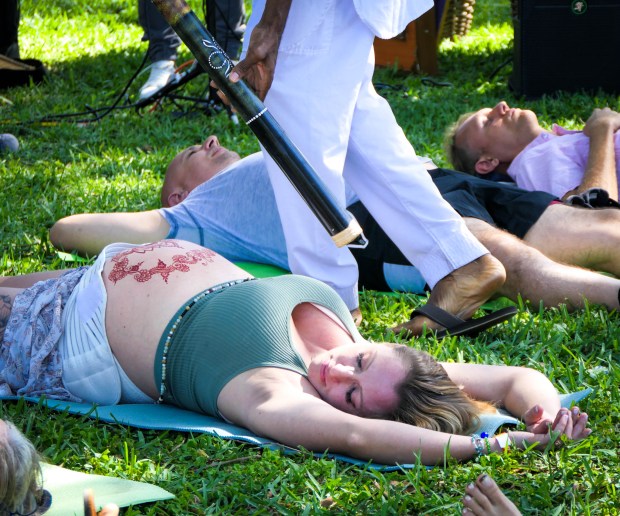 Tatum Tervola relaxes during the sound healing session at the Community Birth Wellness Festival & Midwife360 Family Reunion. The event brought together families, midwives, doulas, and healthcare providers to celebrate family wellness on Saturday, April 6th in West Palm Beach. The event at Dreher Park featured workshops, talks, and demonstrations on natural childbirth, breastfeeding, postpartum care, holistic health, and family life. (Scott Luxor/Contributor)