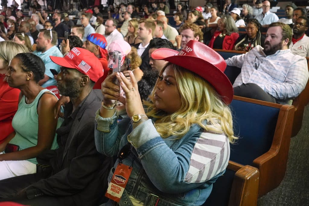 People listen as Republican presidential candidate former President Donald Trump speaks at a campaign event at 180 Church, Saturday, June 15, 2024, in Detroit. (AP Photo/Carlos Osorio)