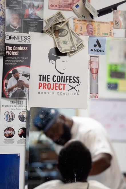 J. Divine Alexander cuts Eddie Dyre’s hair on Sunday, June 23, 2024 at his barbershop in Louisville, Ky. Alexander is a part of The Confess Project is a national mental-health advocacy program that train barbers and stylists to become mental health advocates within the Black community.