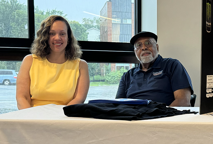 Ronda Chakolis, DPharm, MPH, and Clarence Jones at the Hue-MAN Partnership's table at the event.