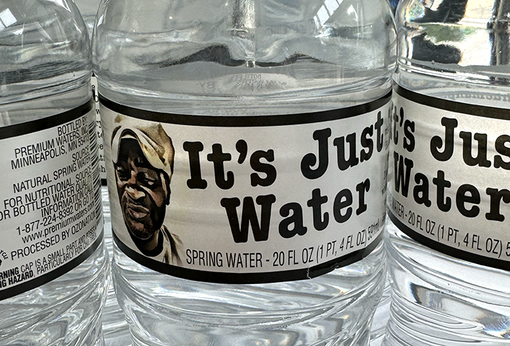 On the It’s Just Water bottles was an image of founder Chuck Thomas, along with his story.