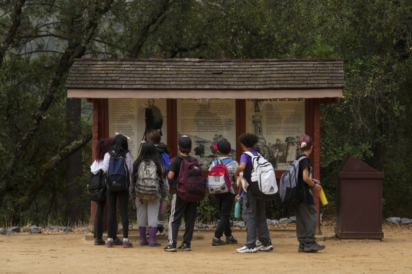 Children visit Marshall Gold Discovery State Historic Park, Tuesday, Oct. 10, 2023, in Coloma, Calif. (AP Photo/Godofredo A. Vásquez)