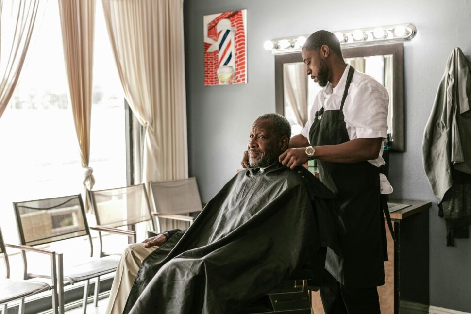 barber preparing to cut client's hair