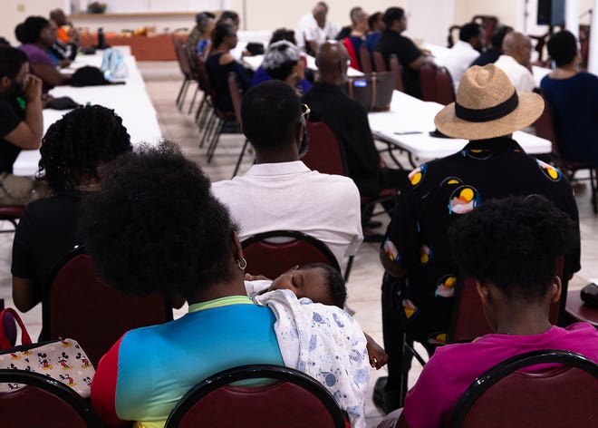 Family members attend the unveiling of six small business historical markers at Macedonia Missionary Baptist Church in Panama City, Fla., Sept. 14, 2024. The markers showcase the legacy of entrepreneurship and community spirit that defines the city’s Glenwood neighborhood. (Tyler Orsburn/News Herald)