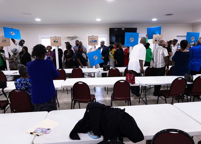 Family members unveil six small business historical markers at Macedonia Missionary Baptist Church in Panama City, Fla., Sept. 14, 2024. The markers showcase the legacy of entrepreneurship and community spirit that defines the city’s Glenwood neighborhood. (Tyler Orsburn/News Herald)