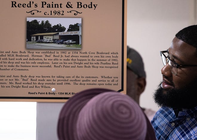 Friends and family gather around Reed’s Paint & Body historical marker at Macedonia Missionary Baptist Church in Panama City, Fla., Sept. 14, 2024. The marker showcases the legacy of entrepreneurship and community spirit that defines the city’s Glenwood neighborhood. (Tyler Orsburn/News Herald)