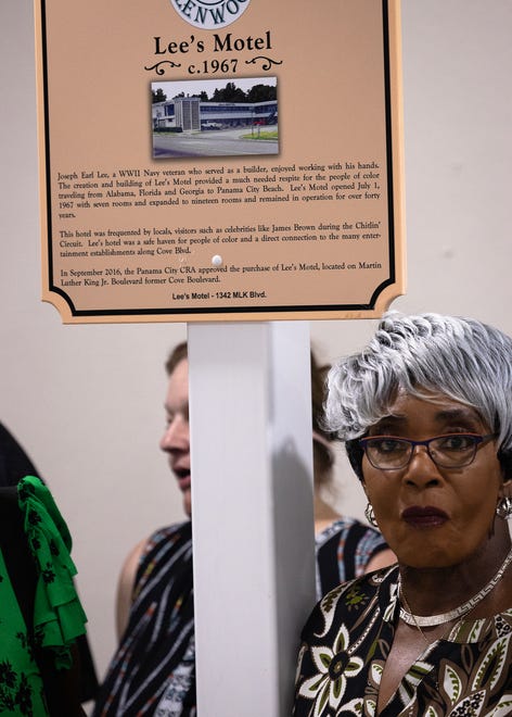 Friends and family gather around Lee’s Motel historical marker at Macedonia Missionary Baptist Church in Panama City, Fla., Sept. 14, 2024. The marker showcases the legacy of entrepreneurship and community spirit that defines the city’s Glenwood neighborhood. (Tyler Orsburn/News Herald)