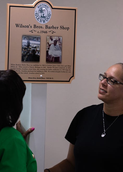 Friends and family gather around Wilson Bros. Barber Shop’s historical marker at Macedonia Missionary Baptist Church in Panama City, Fla., Sept. 14, 2024. The marker showcases the legacy of entrepreneurship and community spirit that defines the city’s Glenwood neighborhood. (Tyler Orsburn/News Herald)