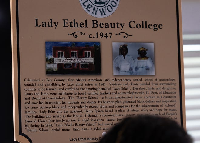 Friends and family gather around Lady Ethel Beauty College’s historical marker at Macedonia Missionary Baptist Church in Panama City, Fla., Sept. 14, 2024. The marker showcases the legacy of entrepreneurship and community spirit that defines the city’s Glenwood neighborhood. (Tyler Orsburn/News Herald)