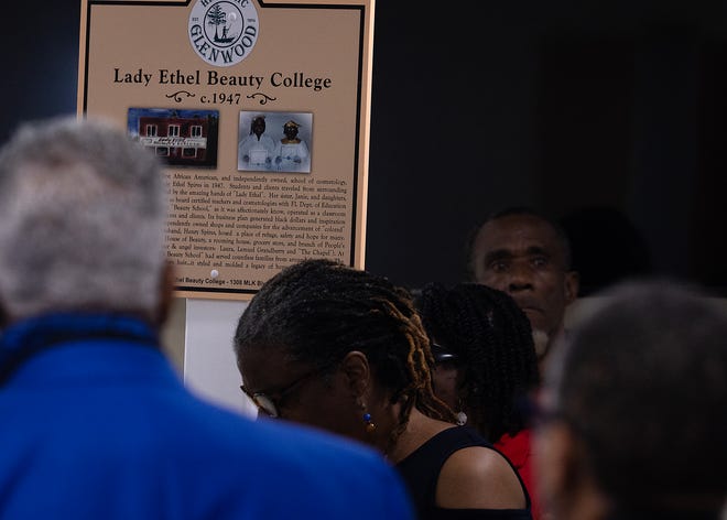 Friends and family gather around Lady Ethel Beauty College’s historical marker at Macedonia Missionary Baptist Church in Panama City, Fla., Sept. 14, 2024. The marker showcases the legacy of entrepreneurship and community spirit that defines the city’s Glenwood neighborhood. (Tyler Orsburn/News Herald)