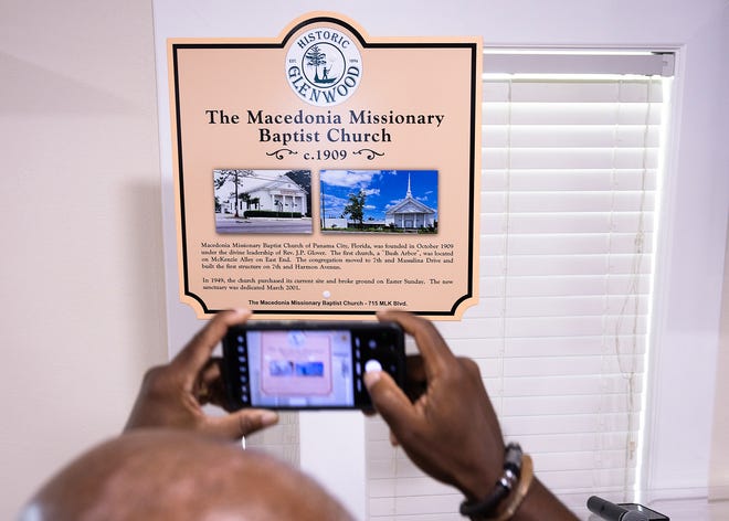 Friends and family gather around Macedonia Missionary Baptist Church’s historical marker at the church in Panama City, Fla., Sept. 14, 2024. The marker showcases the legacy of entrepreneurship and community spirit that defines the city’s Glenwood neighborhood. (Tyler Orsburn/News Herald)