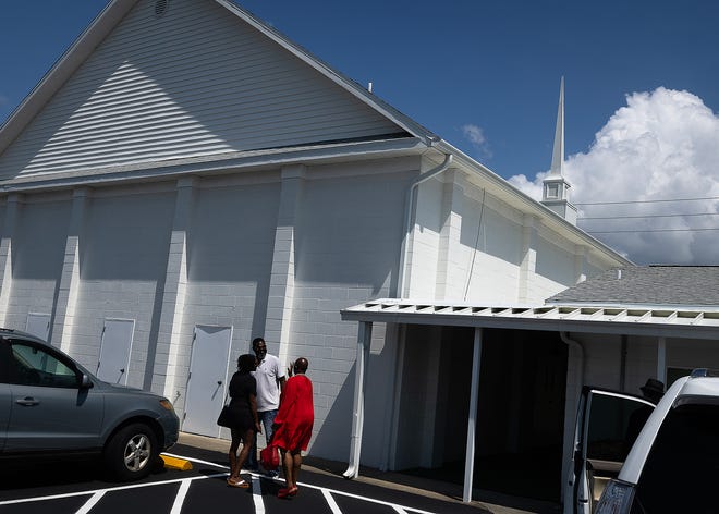 People stand outside Macedonia Missionary Baptist Church in Panama City, Fla., is pictured Sept. 14, 2024. (Tyler Orsburn/News Herald)