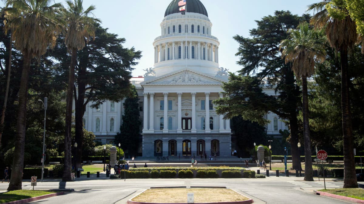 California Capitol building in Sacramento, framed by trees