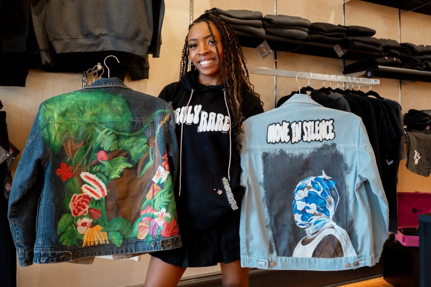 Gabriel Williams, of Truly Rare Customs, on Wednesday, Oct. 23, 2024, at the Eric Outlaw Business Center incubator in The Grove. Williams sells custom clothing, blended with a variety of mixed mediums like painting.