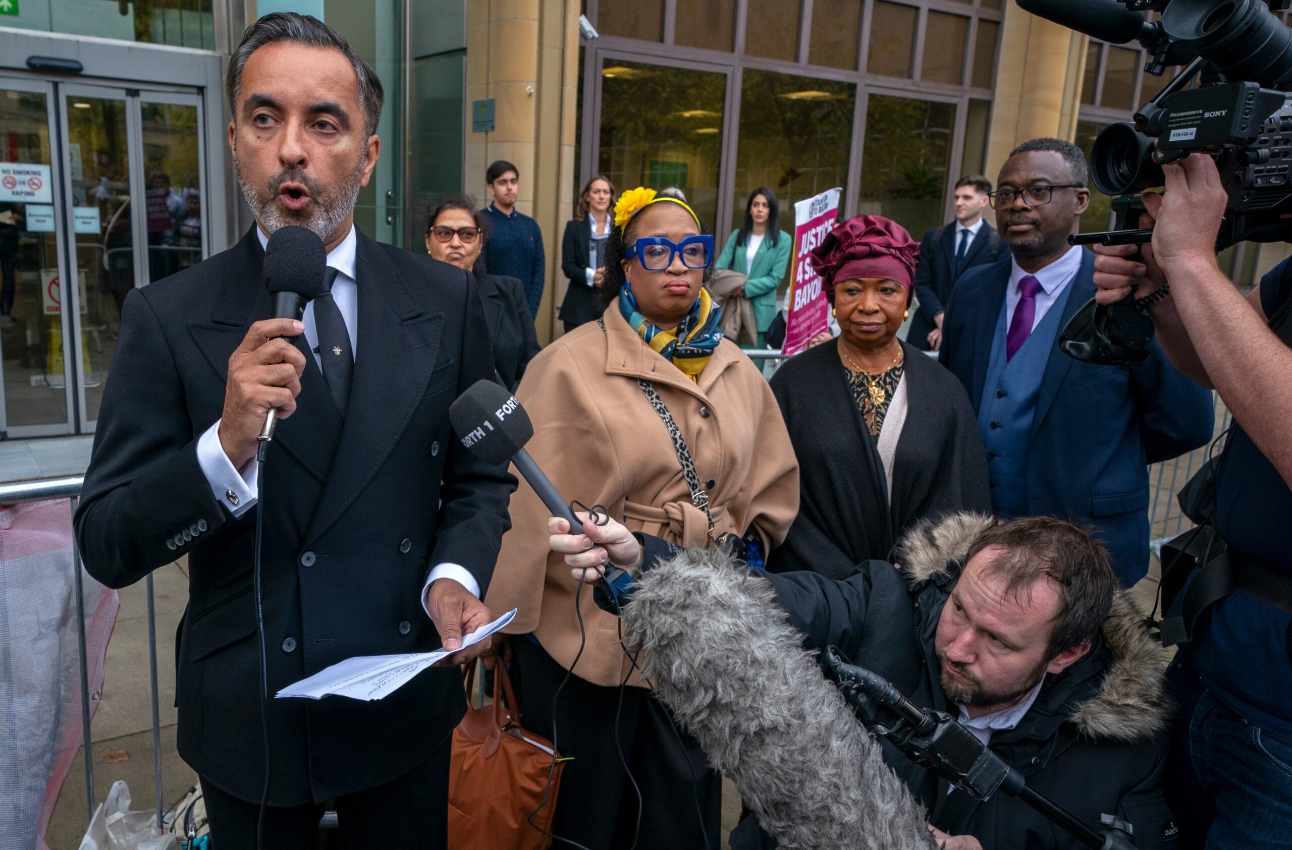 Aamer Anwar with Skehu Bayoh’s sister Kosna, second left, and mother Aminata, outside Capital House, Edinburgh as the inquiry recommences