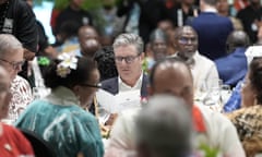 Keir Starmer sits at a dinner table as he attends a reception at the Commonwealth heads of government meeting in Samoa on Thursday.