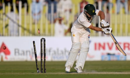 Pakistan’s Kamran Ghulam is bowled by England’s Gus Atkinson