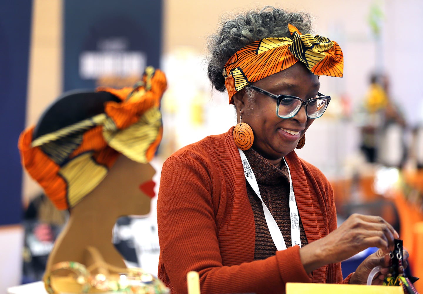 Wendy Matthews, owner of Inside Out Creations, from Dorchester, arranged her items for sale at her booth at the Black-owned pavilion. 