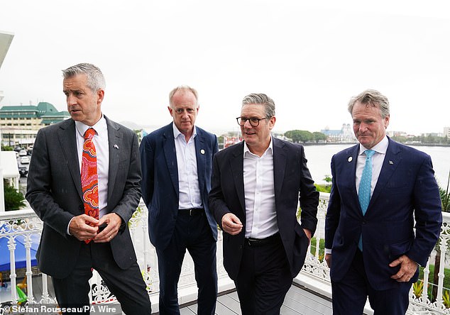 Prime Minister Sir Keir Starmer (second right) meets with Paul Schroder chief executive of AustralianSuper (left), John Neal CEO of Lloyds of London and Brian Moynihan, CEO of Bank of America (right), following his arrival in Apia, Samoa for the Commonwealth Heads of Government Meeting