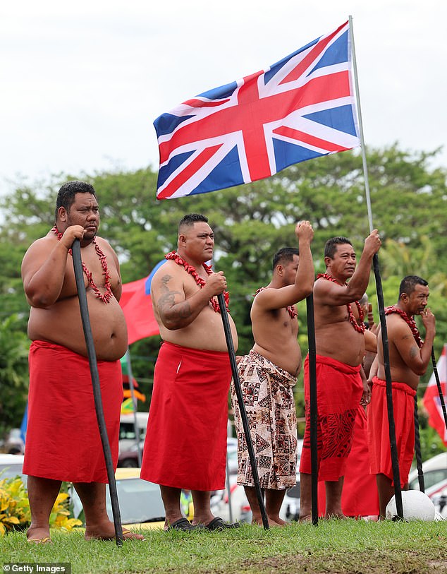 Community members look on during an official Royal 'Ava ceremonial' welcome at the National University of Samoa