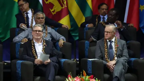 Getty Images Sir Keir Starmer in the front row of a delegation of Commonwealth leaders.