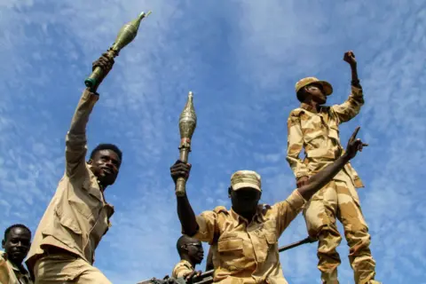 Getty Images New members of Sudan's Gedaref State Police Department attend a graduation ceremony in Gedaref city in the east of the war-torn country, on 5 September 2024