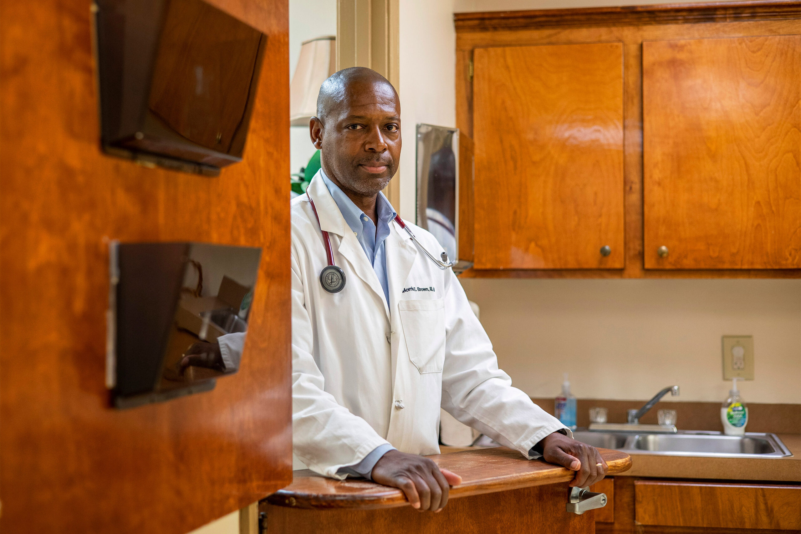 A photo of a Morris Brown at his medical office.