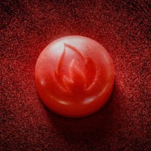 Red Roman spark pill with flame symbol for ED treatment