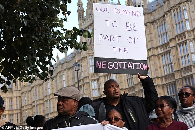 Protesters voicing their opposition to the deal outside Parliament. Downing Street has refused to reveal how much it has offered to pay Mauritius for a 99-year lease of the crucial Anglo-American military base on Diego Garcia, the largest of the Chagos atolls