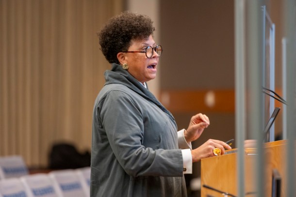 Aimée Zenzele Barnes, manager of the City’s Office of Equity and Diversity, gives a brief presentation of the work the city and community have done to create the reparations resolution. Russell Stiger Jr., OBSERVER