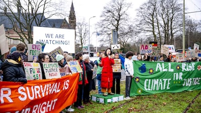 A group of climate activists demonstrate in front of the International Court of Justice in The Hague. AFP