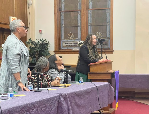 Robin Rue Simmons, a former Evanston city councilmember and current chair of the city's Reparations Committee, speaking at the five year anniversary celebrations of the approval of the city's reparations ordinance. In foreground, left to right: Joanne Braxton, Iva Carruthers and Karli Butler. (Richard Requena/Pioneer Press)