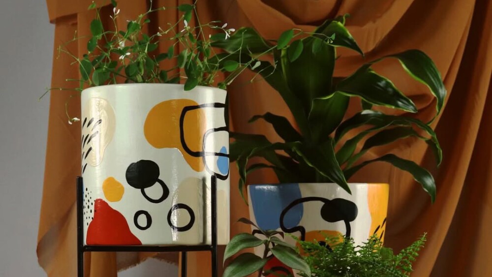 Ceramic planters with funky art styles 