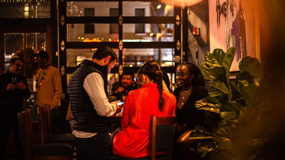 Folks sitting at a table in a restaurant