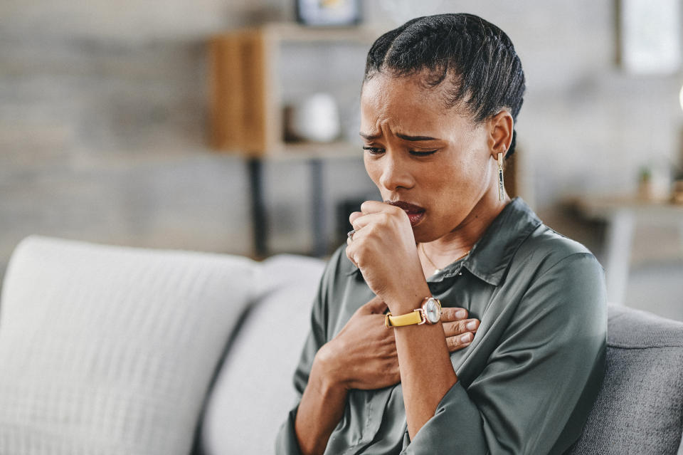 Woman coughing. 