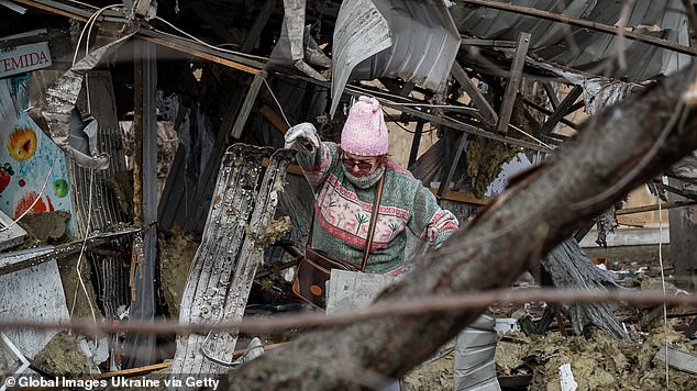 Residents inspect their apartments trying to save surviving belongings and helping each other to clear debris on February 16, 2025 in Mykolaiv, Ukraine